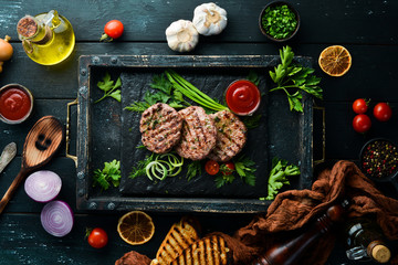 Fototapeta na wymiar Grilled meat cutlets. Cutlets for burger. Top view. Free space for your text.