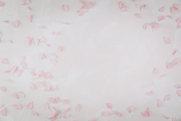 Flowers composition. Pink petals on a trendy marble background. Flat lay, top view