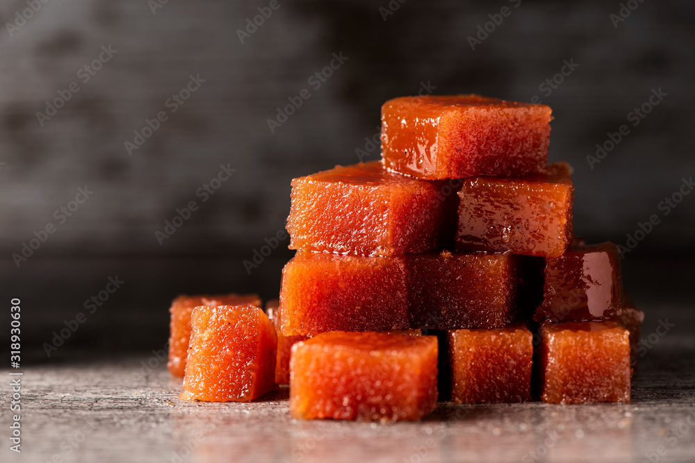 Wall mural dices of quince cheese on a table