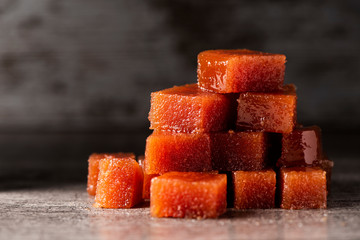 dices of quince cheese on a table