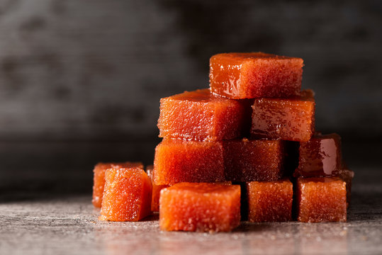 dices of quince cheese on a table