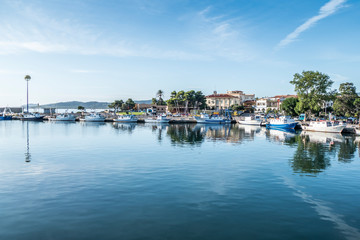 Fototapeta na wymiar The harbor of La Caletta in Sardinia with beautiful reflections
