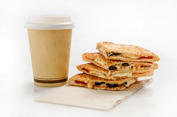 Fototapeta na wymiar Burekas with cheese, olives and a paper cup with coffee