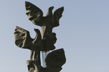 Monument of the Poles deed in the form of Three Eagles. - obrazy, fototapety, plakaty