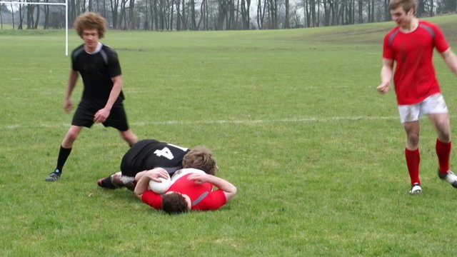 Rugby Match. Two teams on the rugby field battling for the ball.&nbsp;