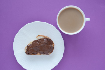 cup with coffee and sandwich with walnut, chocolate paste