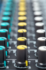 Obraz premium Close-up of volume buttons control of the audio mixer. Selective focus