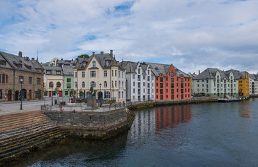 Picturesque summer view of Alesund port town on the west coast of Norway, at the entrance to the Geirangerfjord. Colorful morning cityscape. Traveling concept background.