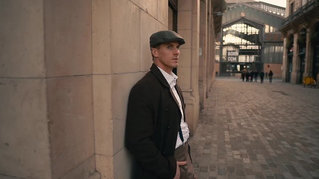 Old Fashion Man from the 1920s england in historical part of city