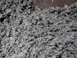 Black texture or background of the earth closeup