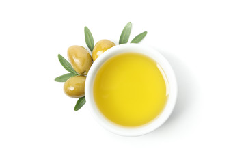 Bowl with olive oil and olives isolated on white background, top view