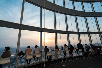 Tokyo, Japan - March 27, 2019:People silhouette inside Observation Deck. Tokyo, Japan.