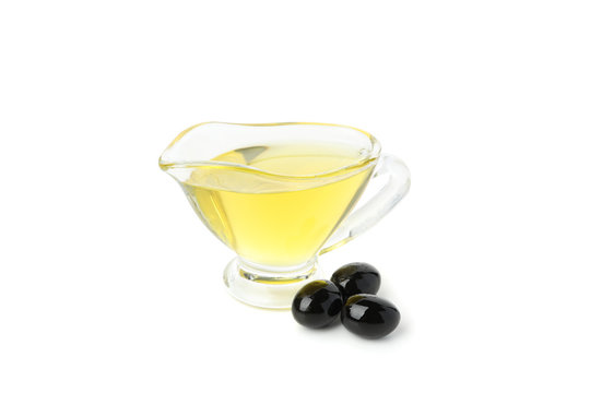 Gravy boat with olive oil and olives isolated on white background