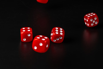 Group of dice close up on dark black background