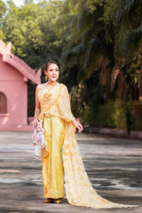 The girl in a Thai style wedding dress