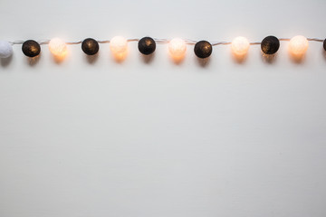 garland of balloons on a white background. Flat lay, top view