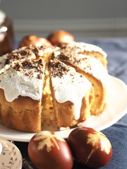 Easter baking with Easter eggs dyed with onion husks with imprints of fresh leaves, on a fabric canvas background. We meet Easter Sunday, tea drinking.