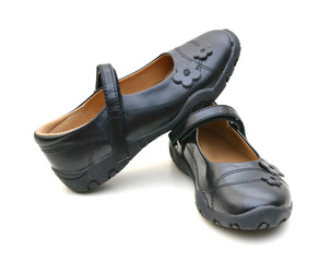 Black shine leather girl shoes isolated on white