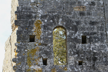 old window in stone wall