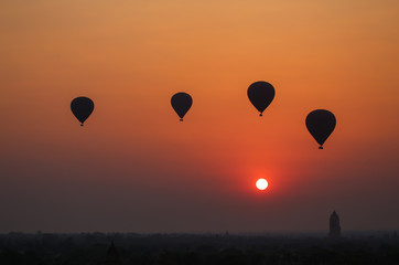 Balloons flying over the ancient pagodas in Bagan