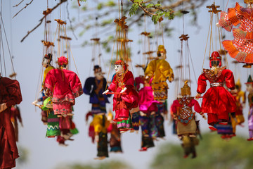Bright souvenirs and puppets on the market in the ancient pagoda in Bagan, Myanmar