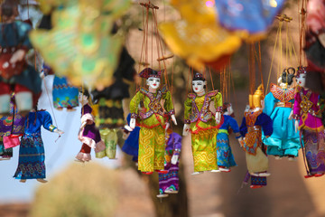 Bright souvenirs and puppets on the market in the ancient pagoda in Bagan, Myanmar