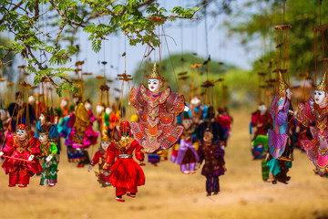 Bright souvenirs and puppets on the market in the ancient pagoda in Bagan, Myanmar