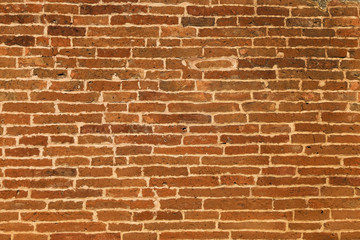 Fototapeta premium The texture of a brick wall of a thousand years old on an ancient pagoda in Burma