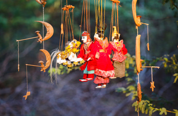 Bright souvenirs and puppets on the market in the ancient pagoda in Bagan, Myanmar