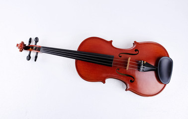 The wooden violin put on background,show detail of stringed instrument