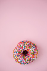 Pink donut on pink background