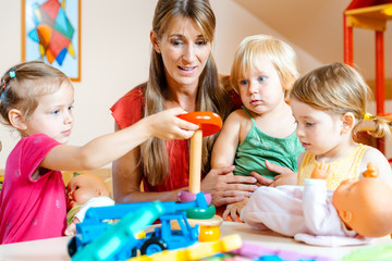 Children in nursery school learning and playing