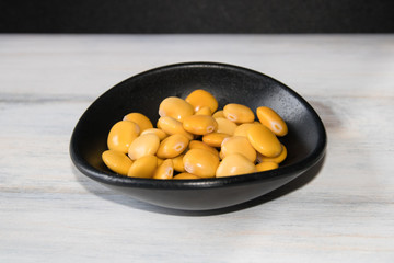 Lupins.  This Healthy snack  has antioxidant and  cardioprotective properties. Lupine is a yellow edible seed.