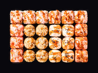 sushi rolls set on a black background