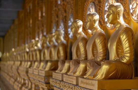 Row of Golden Buddha in Thailand 