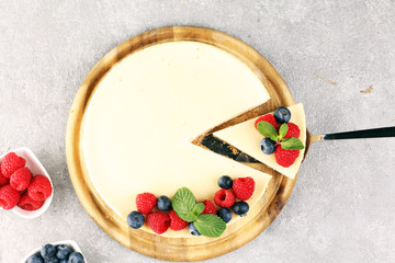 Homemade cheesecake with fresh raspberries and mint for dessert - healthy organic summer dessert pie cheesecake. Vanilla Cheese Cake for dessert