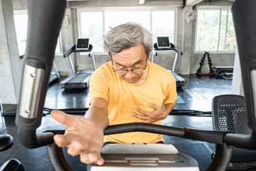 Aged man having a heart attack