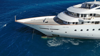 Aerial drone top down photo of luxury yacht docked in Mediterranean destination port with deep blue...