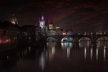 Fototapeta premium Night Prague City with Vltava River and Charles Bridge