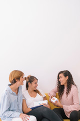 Multiethnic people working together with emotions. Female teacher at psychology class for kids. Start up company. Group of young social workers preparing a human emotion class for children.