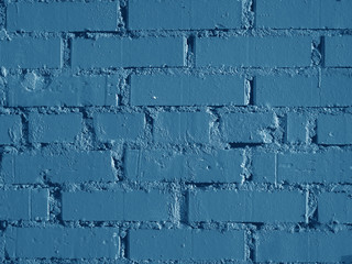 Beautiful abstract texture of a brick wall. Old blue wall painted by new paint.