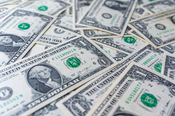 Background from one dollar banknotes. Photographed close-up.