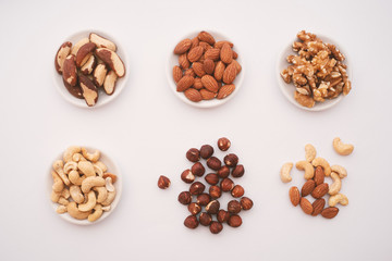 Fototapeta na wymiar Top View Cashew Nuts, Hazelnuts, Almonds, Brazil Nuts and Walnuts