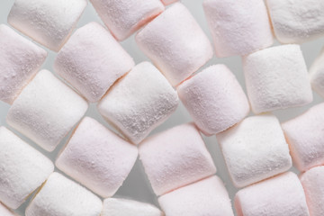 Soft white marshmallows, a type of confectionery which is typically made from sugar, water and gelatin whipped to a squishy consistency