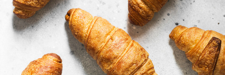 Croissant on a light gray background. Banner