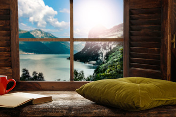 Wooden window sill background with pillows and free space for your decoration.Landscape of spring...