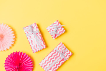 Festive flat lay arrangement of pink gift boxes