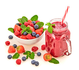 Berry smoothie in glass jar, healthy juicy pink vitamin drink, diet or vegan food concept. Freshly blended homemade fruit vitamins refreshing juicy cocktail. Tasty smoothie with organic berries