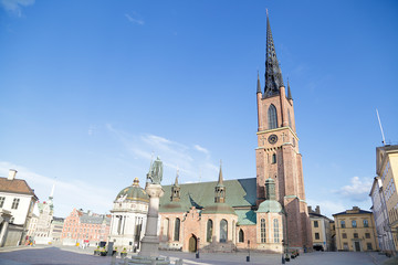 Fototapeta na wymiar Riddarholm church standing in the cobbled Birger Jarls torg square, Stockholm, Sweden
