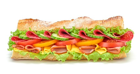 Fresh submarine sandwich with ham, cheese, salami, tomato, lettuce salad, cucumber isolated on white. Colorful tasty baguette homemade large sub sandwich with vegetables. Fast food concept